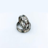 Two silver wedding bands on white background