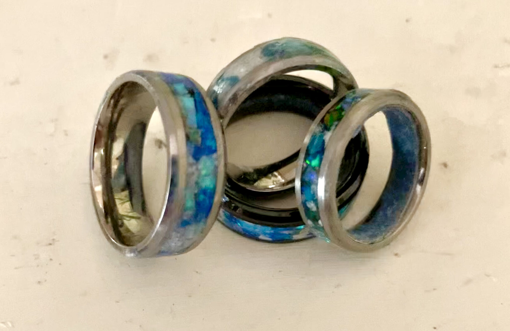 Blue opal inlay metal rings stacked