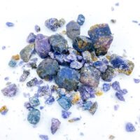 Scattered raw blue and purple crystals