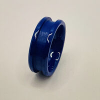 Blue anodized aluminum ring on white background