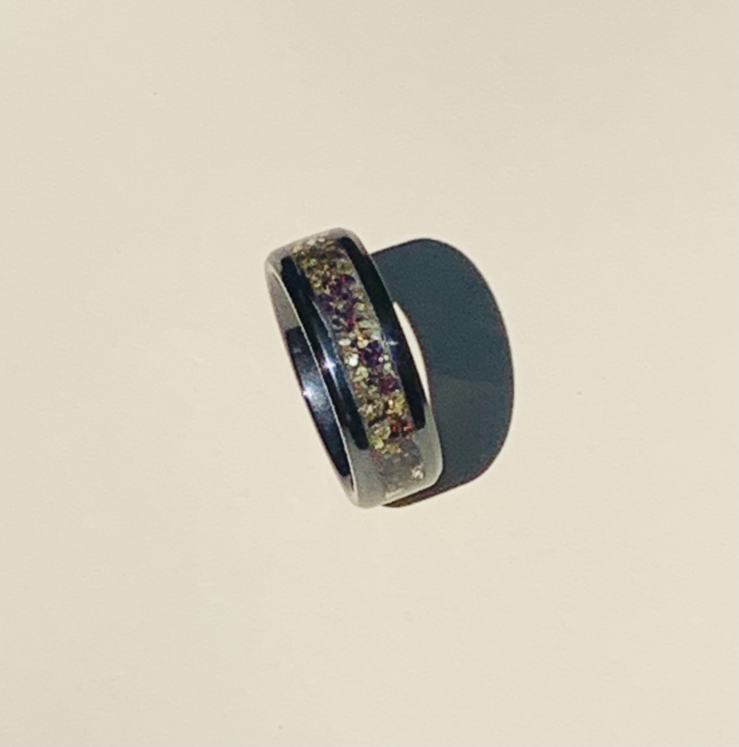 Black ring with glittery gold and purple inlay