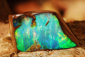 Boulder opal with vivid blue-green iridescence
