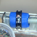 Black ring with opal chip inlay on mandrel