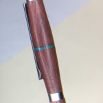 Wooden pen barrel with silver clip