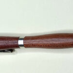 Wooden ballpoint pen with metal accents