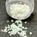 Jar of iridescent opal glitter flakes