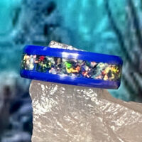 Blue ring with iridescent opal inlay