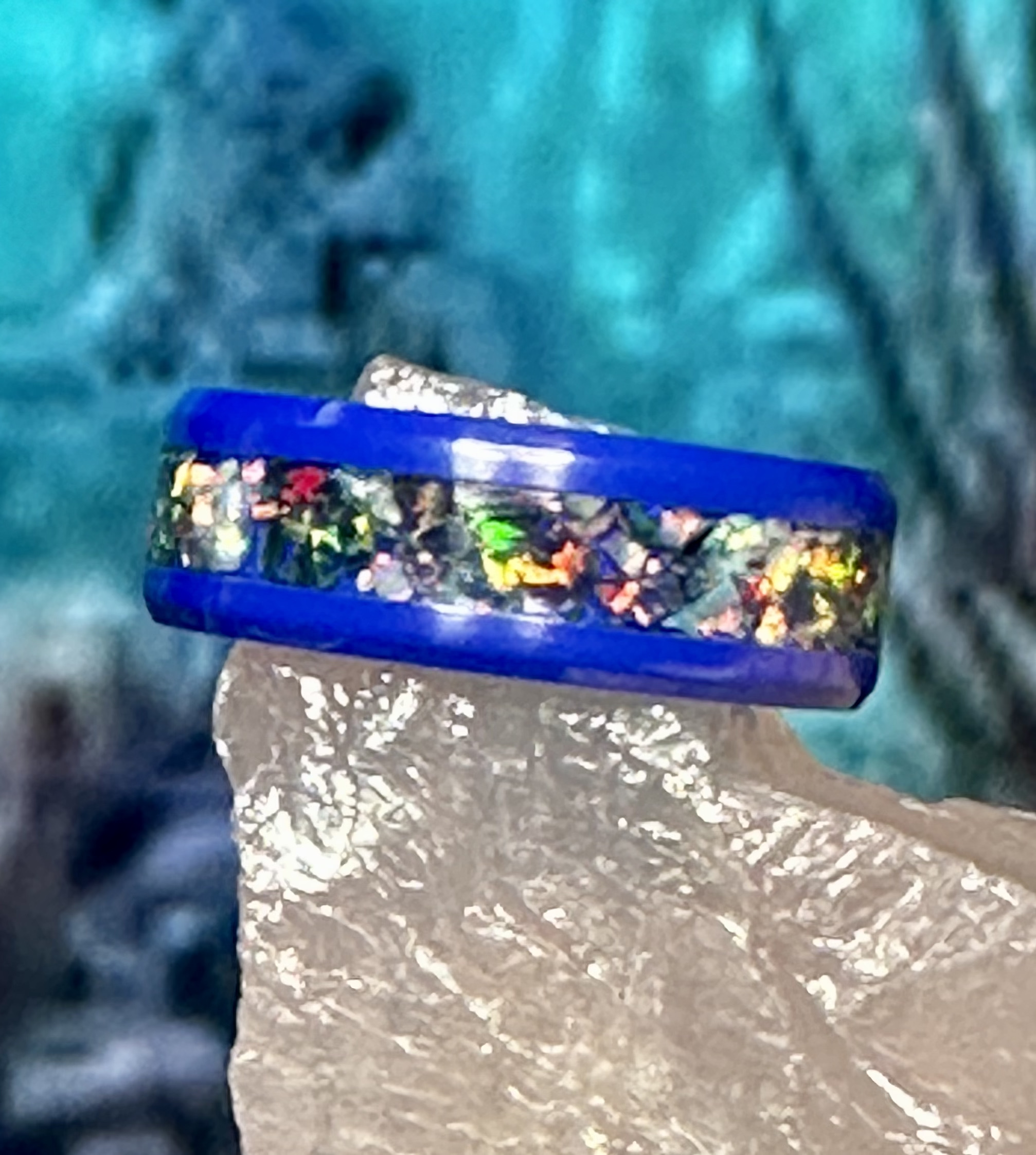 Blue ring with iridescent opal inlay